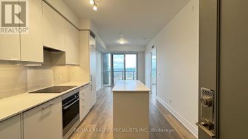 Mississauga (Fairview) condo for rent - A kitchen with white cabinets and a countertop.