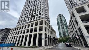 Mississauga (Fairview) condo for rent - A tall building with a lot of windows is under construction.
