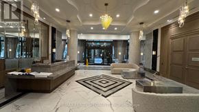 Mississauga (Fairview) condo for rent - A well-lit, spacious lobby with a marble floor and a large chandelier.