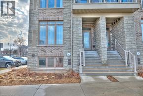 Beamsville townhouse for rent - A stone building with a glass window and a door.