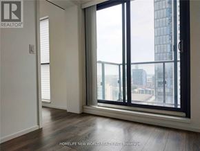 Toronto (Church-Yonge Corridor) condo for rent - A room with a view of the city through large windows.