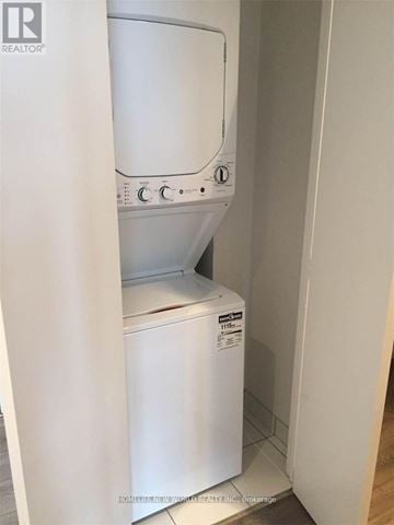 Toronto (Church-Yonge Corridor) condo for rent - A white dishwasher is in a small kitchen.