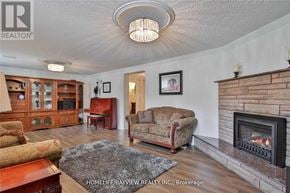 Toronto (York University Heights) apartment for rent - A living room with a fireplace and a couch.