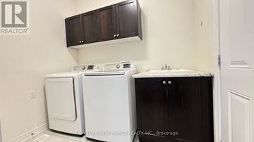 East Gwillimbury apartment for rent - A white dishwasher and a white washing machine are in a kitchen.