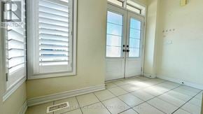 East Gwillimbury apartment for rent - A room with a door, window, and tiled floor.