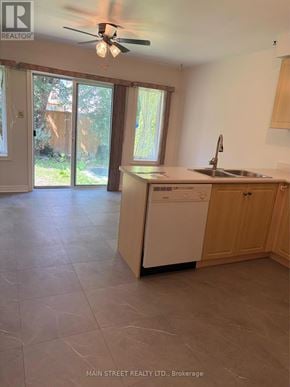 Georgina (Keswick South) apartment for rent - A kitchen with a washer and dryer built in.