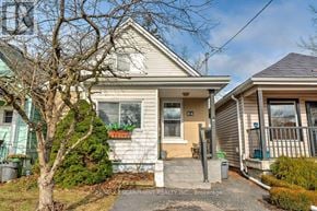 Hamilton (Eastmount) apartment for rent - A house with a white front and a brown roof is shown.
