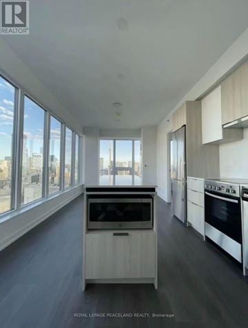 Toronto (Kensington-Chinatown) condo for rent - A modern kitchen with a view of the city.