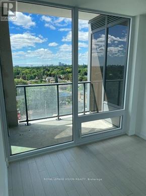 Toronto (Humber Heights) condo for rent - A room with a sliding glass door leading to a balcony.