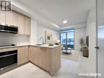 Oakville (Ga Glen Abbey) condo for rent - A modern kitchen with wooden cabinets and stainless steel appliances.