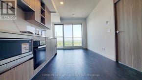 Toronto (Bayview Village) condo for rent - A kitchen with a refrigerator, microwave, and oven.