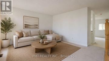 Toronto (West Hill) townhouse for rent - A living room with a white couch and a brown coffee table.