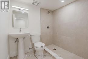 Ottawa apartment for rent - A white sink and toilet in a small bathroom.