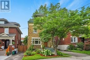 Ottawa apartment for rent - A house with a tree in front of it.
