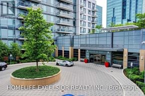 Toronto (Henry Farm) condo for rent - A brokerage office of Homelife Excelsior Realty Inc. is shown with a modern building and a landscaped area in front.
