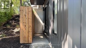 Toronto (High Park North) apartment for rent - A wooden door is open to a modern house.