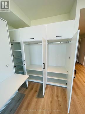 Kitchener condo for rent - Closet with shelves and drawers in a room.