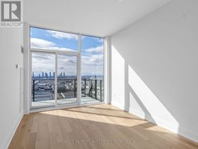 Vaughan (Vellore Village) condo for rent - A room with a view of the city through a large window.