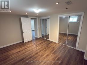 Welland (Lincoln/Crowland) apartment for rent - A room with wooden flooring and a sliding glass door.
