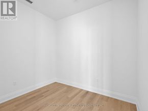 Vaughan (Vellore Village) condo for rent - A room with white walls and wooden flooring.