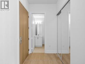 Vaughan (Vellore Village) condo for rent - A white room with a wooden door and a white cabinet.