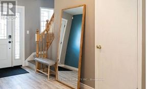 Kitchener apartment for rent - A mirror is leaning against a wall in a room.