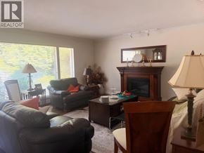 West Vancouver apartment for rent - A living room with a fireplace and a couch.