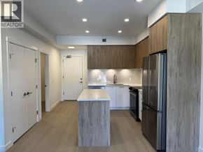New Westminster apartment for rent - A modern kitchen with a large island and stainless steel appliances.