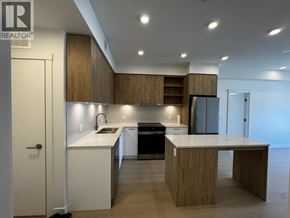New Westminster apartment for rent - A modern kitchen with wooden cabinets and a large island.