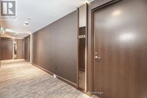 Toronto (Annex) condo for rent - A hallway with a door numbered 3204 and a brokerage sign.