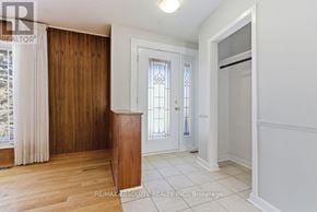 Ottawa apartment for rent - A room with a wooden door and a white door with a glass window.