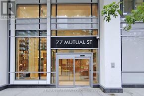 Toronto (Church-Yonge Corridor) condo for rent - The front of a building with the sign 77 Mutual St.