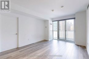 Toronto (Church-Yonge Corridor) condo for rent - A large, empty room with a sliding glass door leading to a balcony.