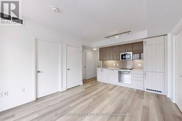 Toronto (Church-Yonge Corridor) condo for rent - A spacious kitchen with white cabinets and a stainless steel oven.