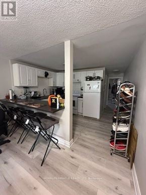 Mississauga (Streetsville) multi-family for rent - A kitchen with a table and chairs.