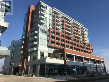 Markham (Unionville) condo for rent - A modern multi-story building with a glass facade and a red accent.