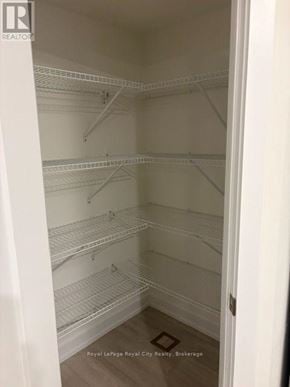 Guelph (Clairfields/Hanlon Business Park) townhouse for rent - Empty white shelves in a room.