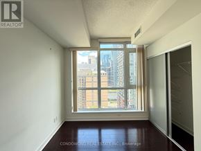 Toronto (Waterfront Communities) condo for rent - A room with a window that has a view of a city.