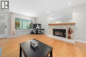 North Vancouver apartment for rent - A living room with a fireplace and a coffee table.