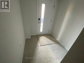 Cambridge townhouse for rent - A hallway with a door leading to a balcony.