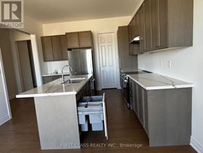 Georgina (Keswick North) apartment for rent - A kitchen with a white counter top and brown cabinets.