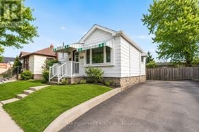 Hamilton (Inch Park) apartment for rent - A white house with a green awning is for sale.
