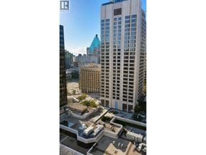 Vancouver apartment for rent - A tall building with a blue top stands out against the skyline.