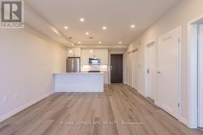 Port Colborne (Sugarloaf) condo for rent - A spacious room with a kitchenette and a refrigerator.