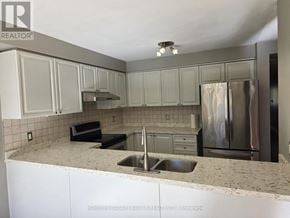 Ajax (Northeast Ajax) apartment for rent - A kitchen with a sink, stove, and refrigerator.