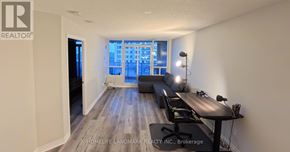 Toronto (Bayview Village) condo for rent - A well-lit room with a dining table and chairs.
