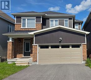 Ottawa apartment for rent - A two-story house with a garage is for sale.