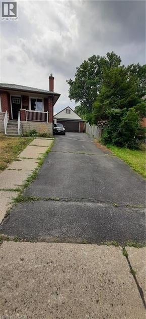 Kitchener apartment for rent - A residential street with houses on both sides.