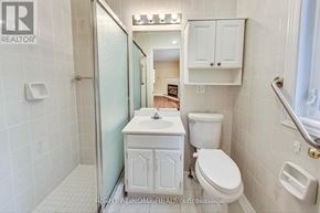 Toronto (Lansing-Westgate) apartment for rent - A white bathroom with a toilet, sink, and shower.