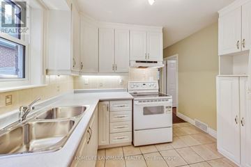 Toronto (Lansing-Westgate) apartment for rent - A kitchen with white cabinets and appliances.